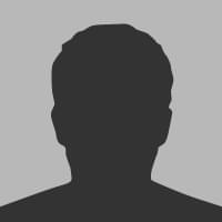 Placeholder headshot. A dark gray silhouette of a person's head in front of a gray background.